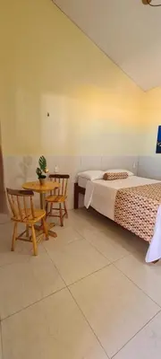 Uma cama ou camas num quarto em Sua própria pousada na praia