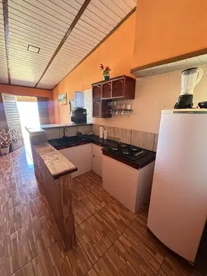 A cozinha ou kitchenette de Sereia beach chalé