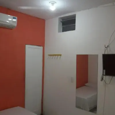 Uma cama ou camas num quarto em Pousada Maresia