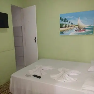 Uma cama ou camas num quarto em Pousada Maresia