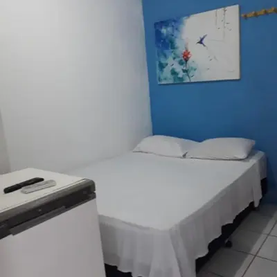 Uma cama ou camas num quarto em Pousada Maresia