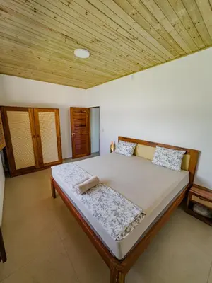 Uma cama ou camas num quarto em Casa da Jô, Fortim Barra