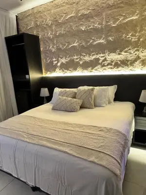Uma cama ou camas num quarto em Luce del sole bangalô