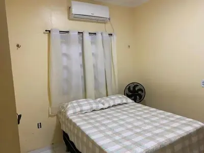 Uma cama ou camas num quarto em Casa Aconchego Preá