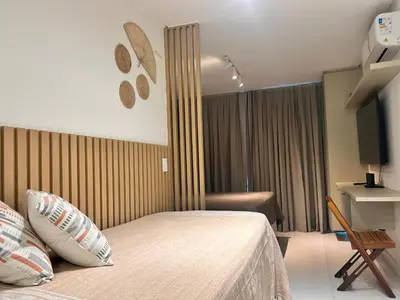 Uma televisão e/ou sistema de entretenimento em Fortaleza Apartamento - Flat Novo