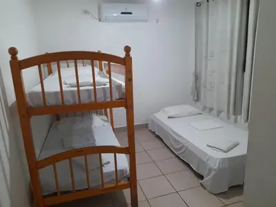 Uma cama ou camas num quarto em Casa Branca Porto Das Dunas