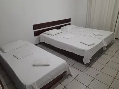 Uma cama ou camas num quarto em Casa Branca Porto Das Dunas