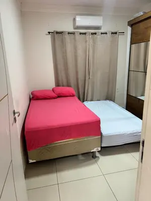 Uma cama ou camas num quarto em Casa completa com 3 quartos,ar e garagem