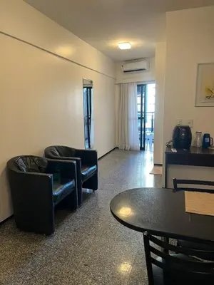 Uma área de estar em Flat em Fortaleza - Ce Vista Mar - Meireles