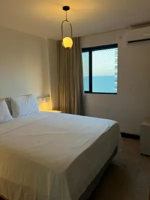 Uma cama ou camas num quarto em Apartamento Mobiliado Fortaleza - uma quadra da Beira Mar