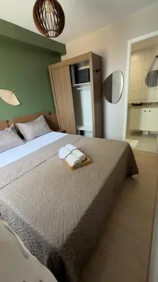 Uma cama ou camas num quarto em Ap Mirante Fortaleza 5min da Praia com Piscina e Rooftop para 6 pessoas