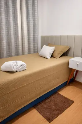 Uma cama ou camas num quarto em Apartamento em Fortaleza