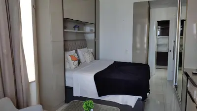 Uma cama ou camas num quarto em Golden suíte Frente Mar 1152