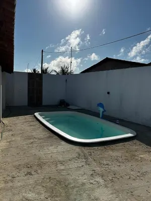 A piscina em ou perto de Casa de praia com piscina