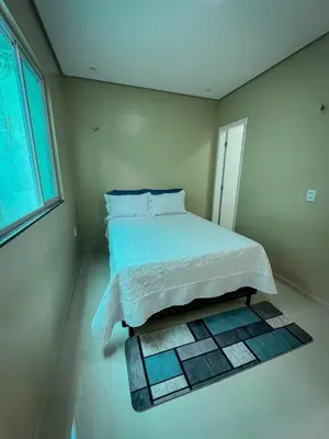 Uma cama ou camas num quarto em CASA LUME Mulungu CE 20 min from Guaramiranga