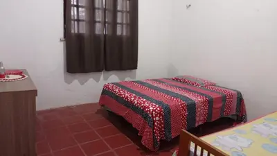 Uma cama ou camas num quarto em Duplex vizinho ao Resort Carmel