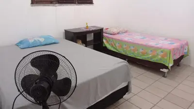 Uma cama ou camas num quarto em Duplex vizinho ao Resort Carmel