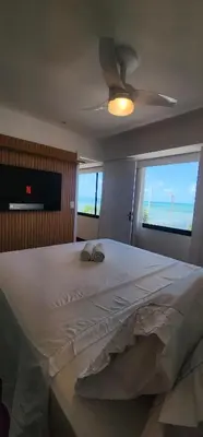 Uma televisão e/ou sistema de entretenimento em Beira Mar Scala by DS Imóveis