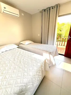 Uma cama ou camas num quarto em Residencial Vista Mar