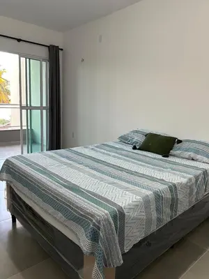 Uma cama ou camas num quarto em Recanto da Frida