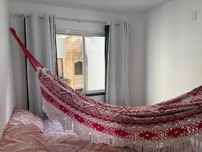 Uma cama ou camas num quarto em Recanto da Frida
