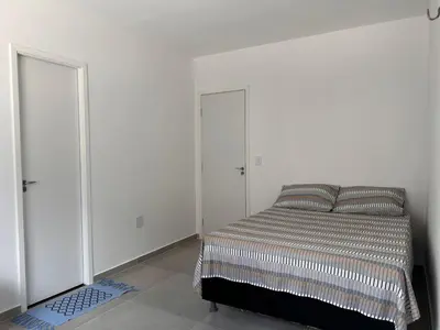 Uma cama ou camas num quarto em Recanto da Frida