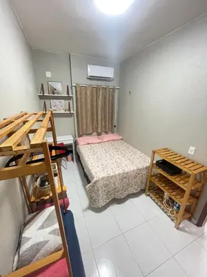 Uma cama ou camas num quarto em Apartamento Império das Marés