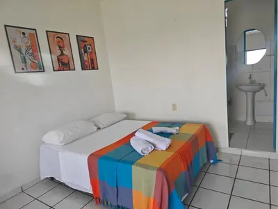 Uma cama ou camas num quarto em Casa Jambo Canoa Quebrada