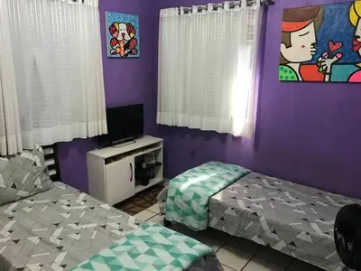 Uma cama ou camas num quarto em Apartamento na praia do Icaraí com 2 suites