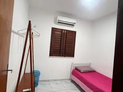 Uma cama ou camas num quarto em Casa Paracuru