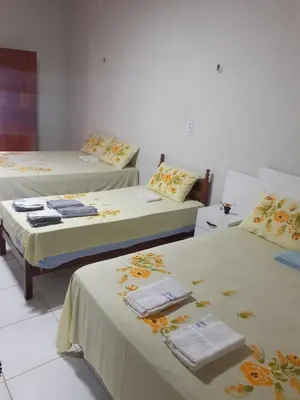 Uma cama ou camas num quarto em Cantinho do sossego
