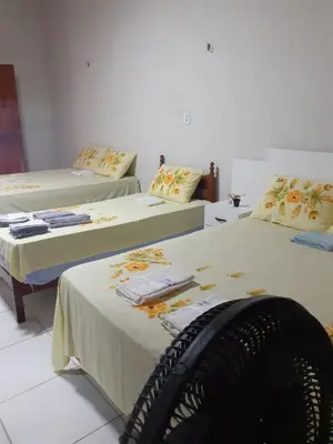 Uma cama ou camas num quarto em Cantinho do sossego