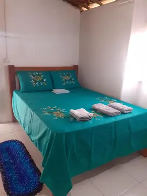 Uma cama ou camas num quarto em Cantinho do sossego
