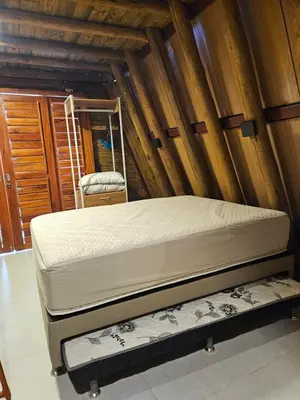Uma cama ou camas num quarto em Cabana Redonda Beach