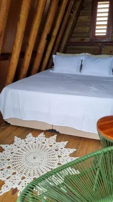 Uma cama ou camas num quarto em Cabana Redonda Beach