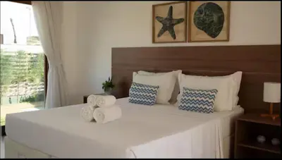 Uma cama ou camas num quarto em Resort Coral Beach - Casa 18