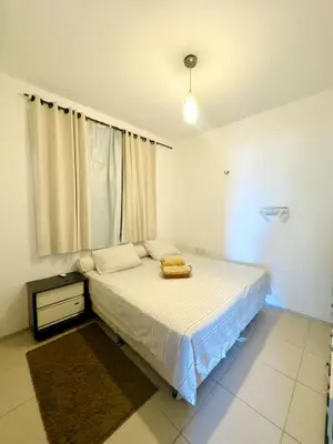 Uma cama ou camas num quarto em Apartamento frente para o Mar na Praia das Fontes