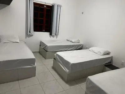 Uma cama ou camas num quarto em Recanto do tdias