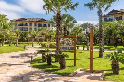 Um jardim no exterior de VG Sun Cumbuco #403 Vista Mar by Carpediem