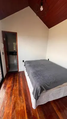 Uma cama ou camas num quarto em Recanto dos Ps