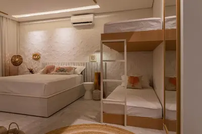 Uma cama ou camas num quarto em The House Bangalô 08