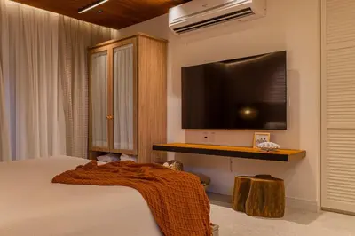 Uma cama ou camas num quarto em The House Bangalô 08