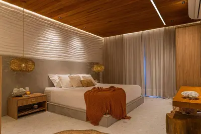 Uma cama ou camas num quarto em The House Bangalô 08