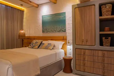 Uma cama ou camas num quarto em The House Bangalô 08