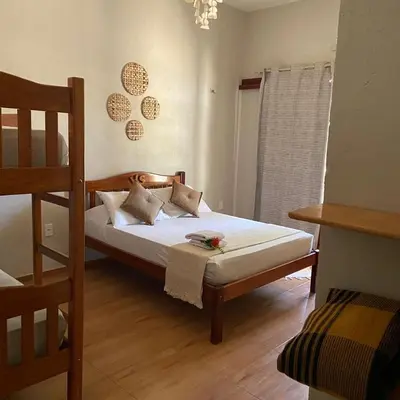 Uma cama ou camas num quarto em Rekanto Sabiá