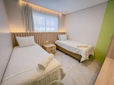 Uma cama ou camas num quarto em Vibes Beach House