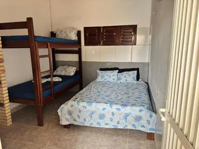 Uma cama ou camas num quarto em Casa Alemao Caponga