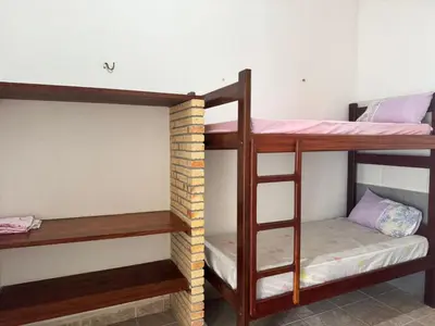 Uma cama ou camas num quarto em Casa Alemao Caponga