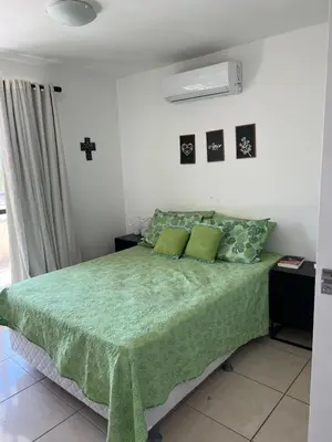 Uma cama ou camas num quarto em Condominio sun village cumbuco
