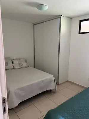 Uma cama ou camas num quarto em Condominio sun village cumbuco